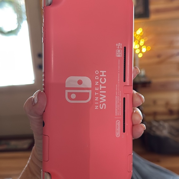 Like new orange/coral nintendo switch lite 32GB. Handheld.Excellent t condition. - Picture 2 of 5